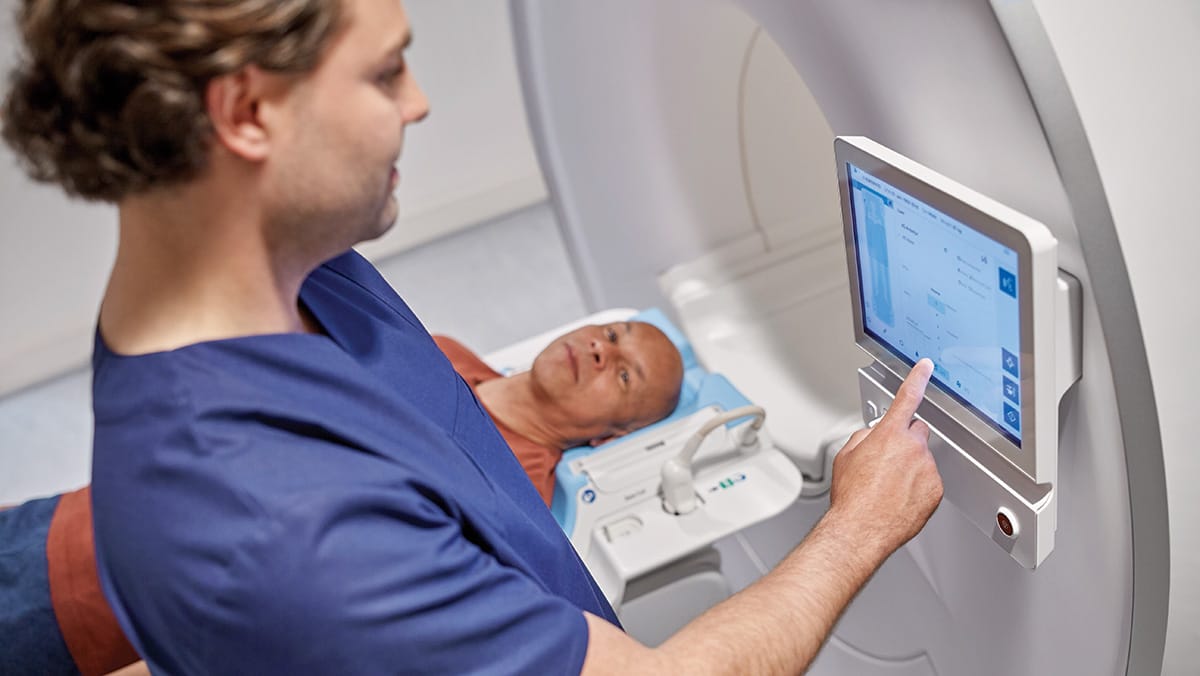 Download image (.jpg) (opens in a new window) Two doctors reviewing mammogram case